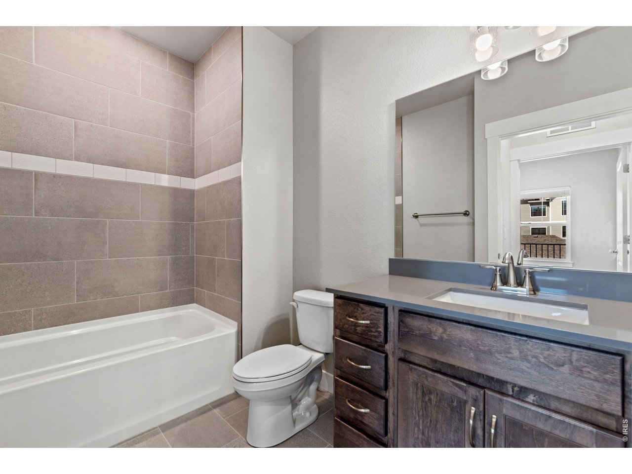Property Photo 9 Second Bath- Finishes may vary. Not actual home. 
