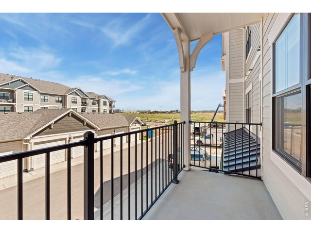 Property Photo 11 Covered Deck- Finishes may vary. 