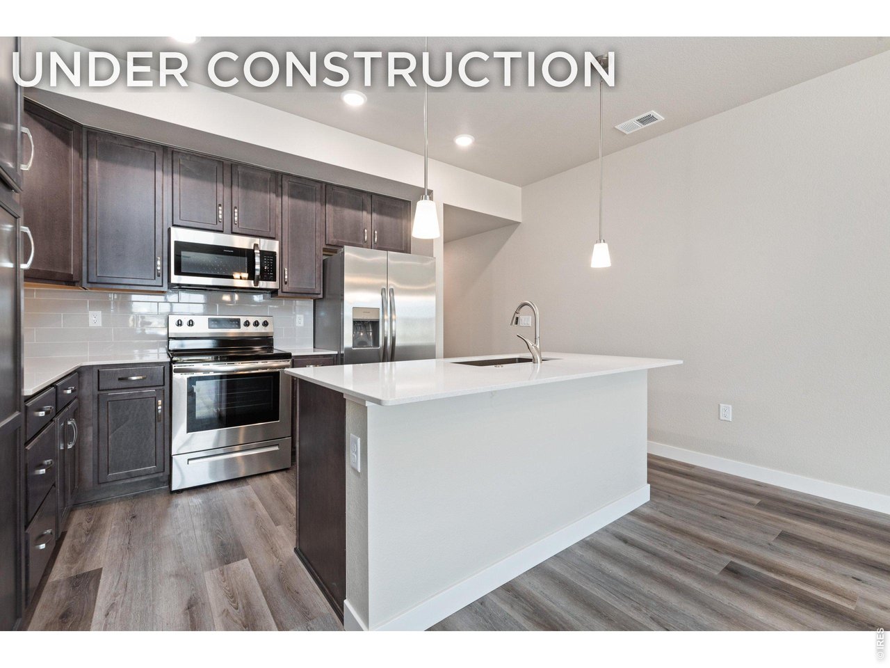 Property Photo 17 Kitchen - Finishes may vary. Not actual unit. 
