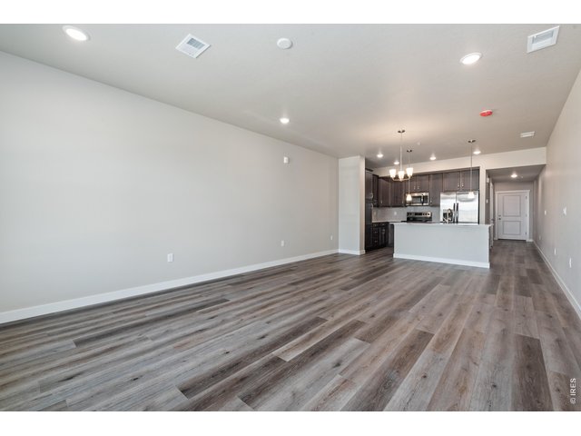 Property Photo 19 Kitchen and Great Room - Finishes may vary. Not actual unit. 