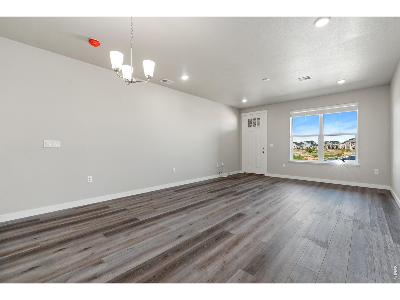 Property Photo 20 Great Room - Finishes may vary. Not actual unit. 