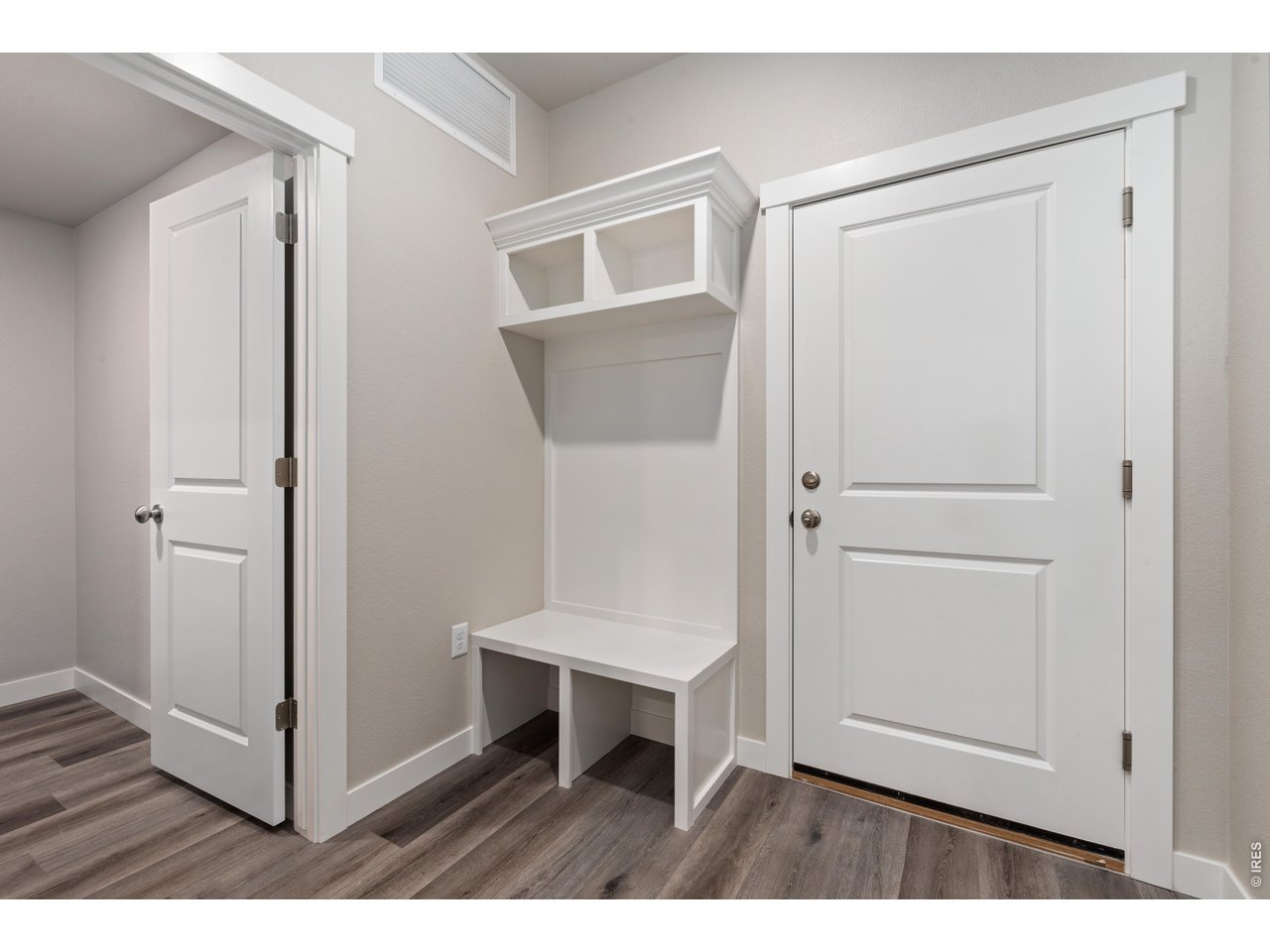 Property Photo 21 Entry from Garage - Finishes may vary. Not actual unit. 