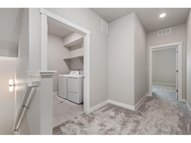 Property Photo 29 Laundry - Finishes may vary. Not actual unit. 