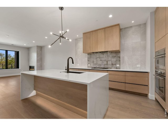 Property Photo 5 Kitchen island features toe kick lighting