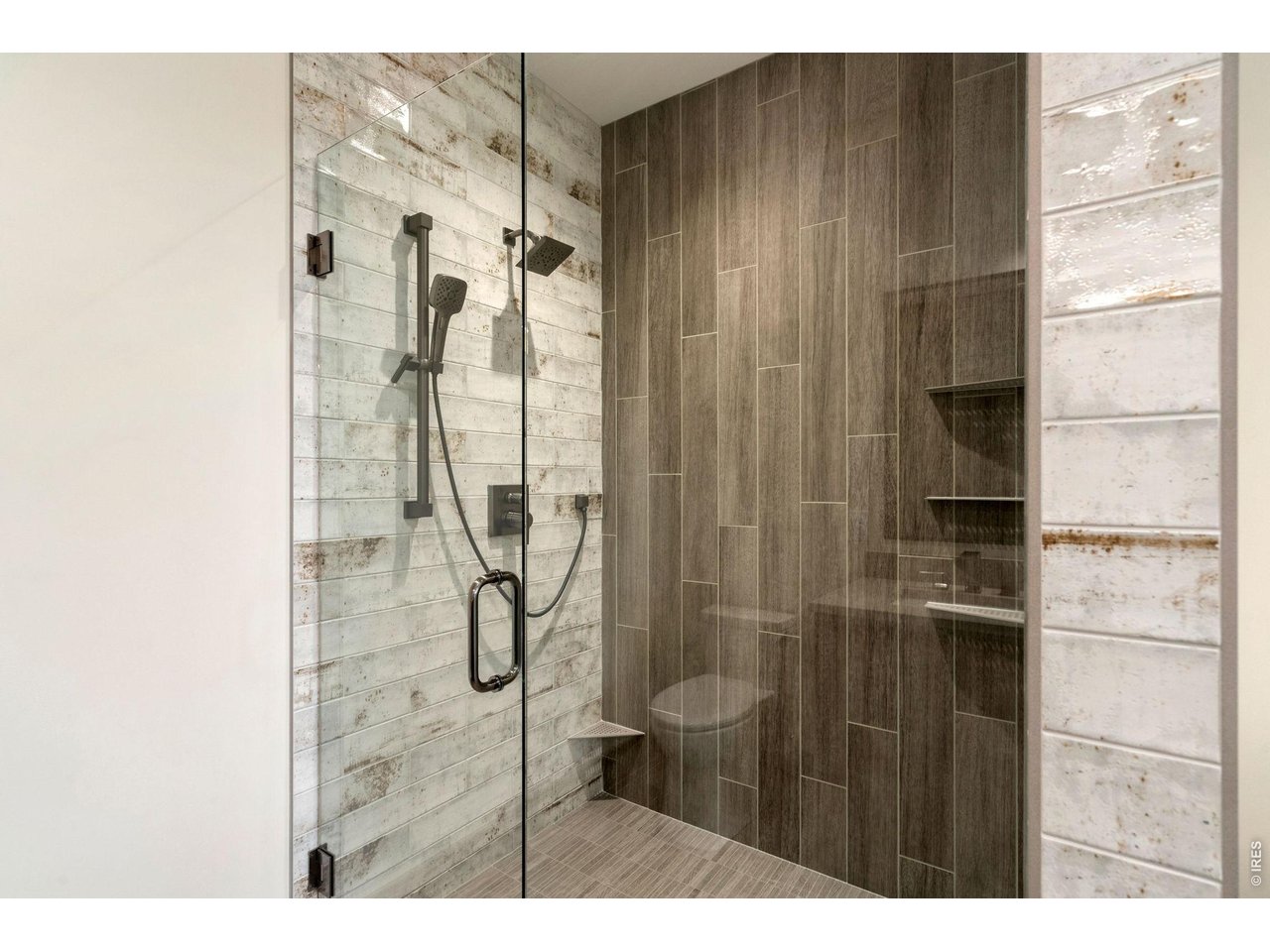 Ceiling to floor tile shower in primary bathroom