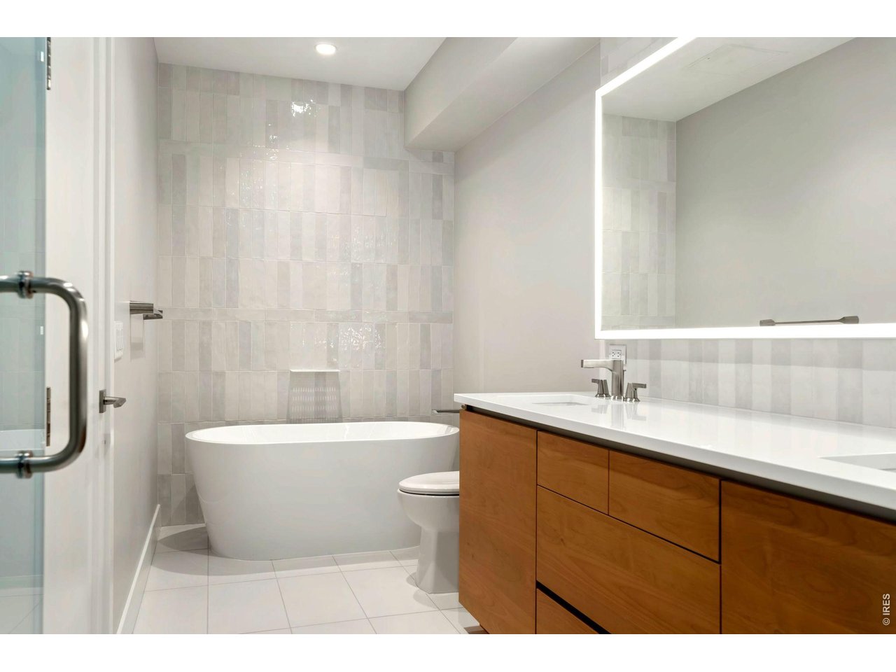 Epic 5 piece primary bathroom with standalone soaking tub