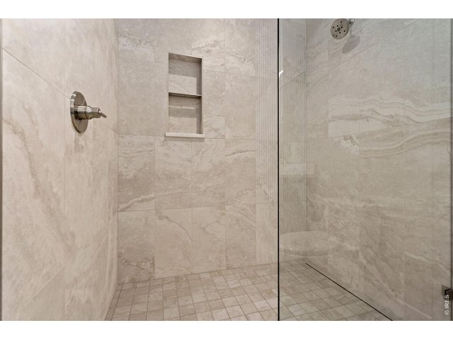 Property Photo 23 Bedroom 2 ceiling to floor custom tile shower