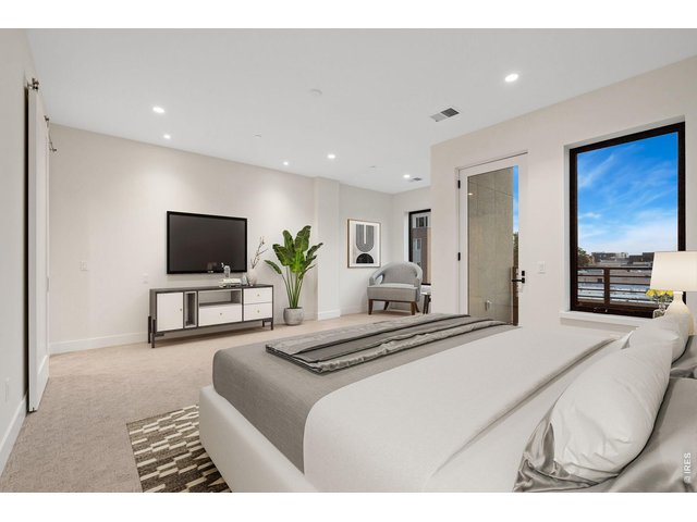 Property Photo 11 large 14' x 18' primary ensuite with an abundance of windows and natural light