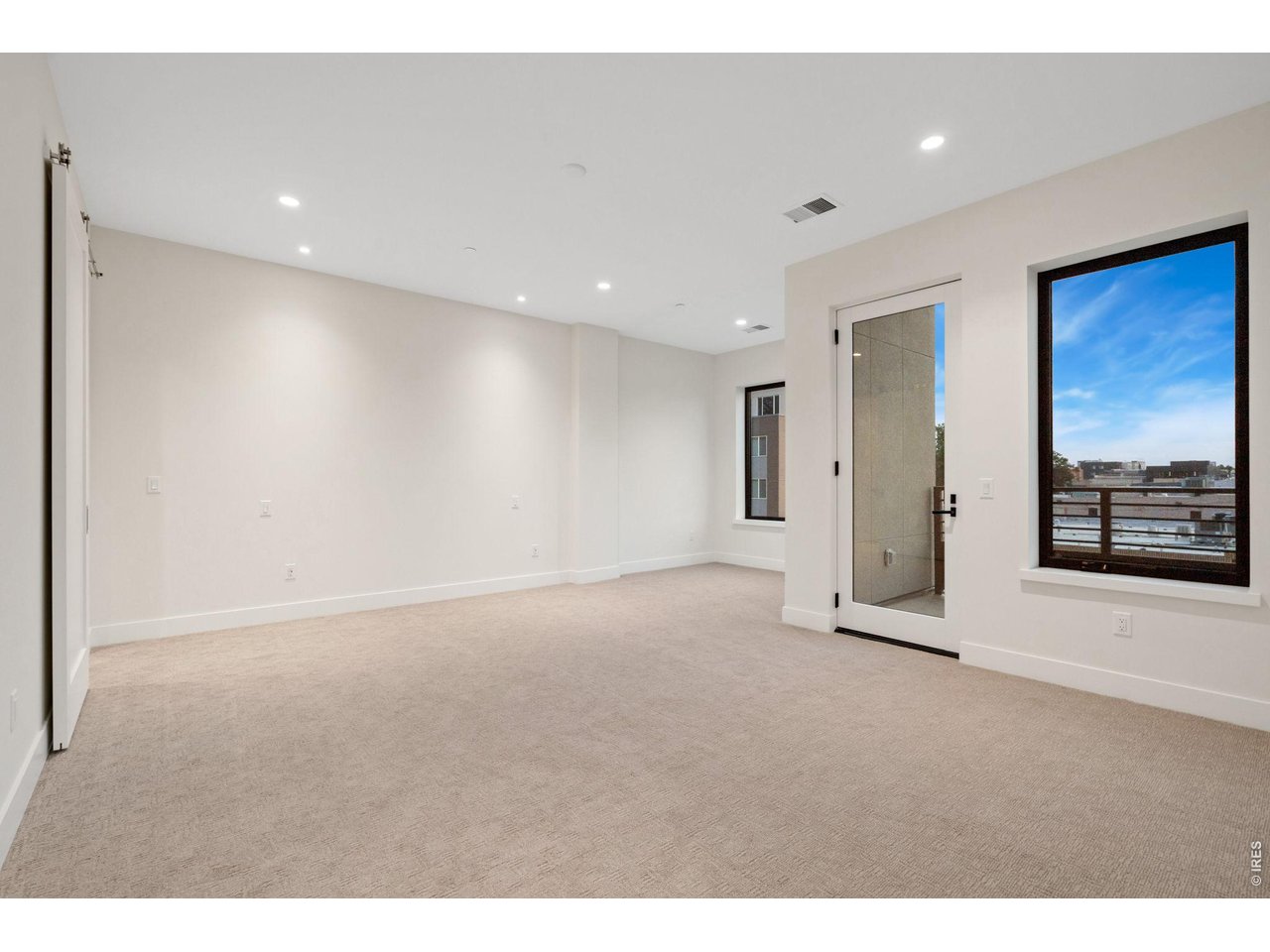 Walkout private balcony off of primary bedroom