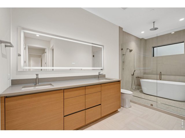 Property Photo 13 Custom 5 piece primary bathroom with standalone tub in-shower design
