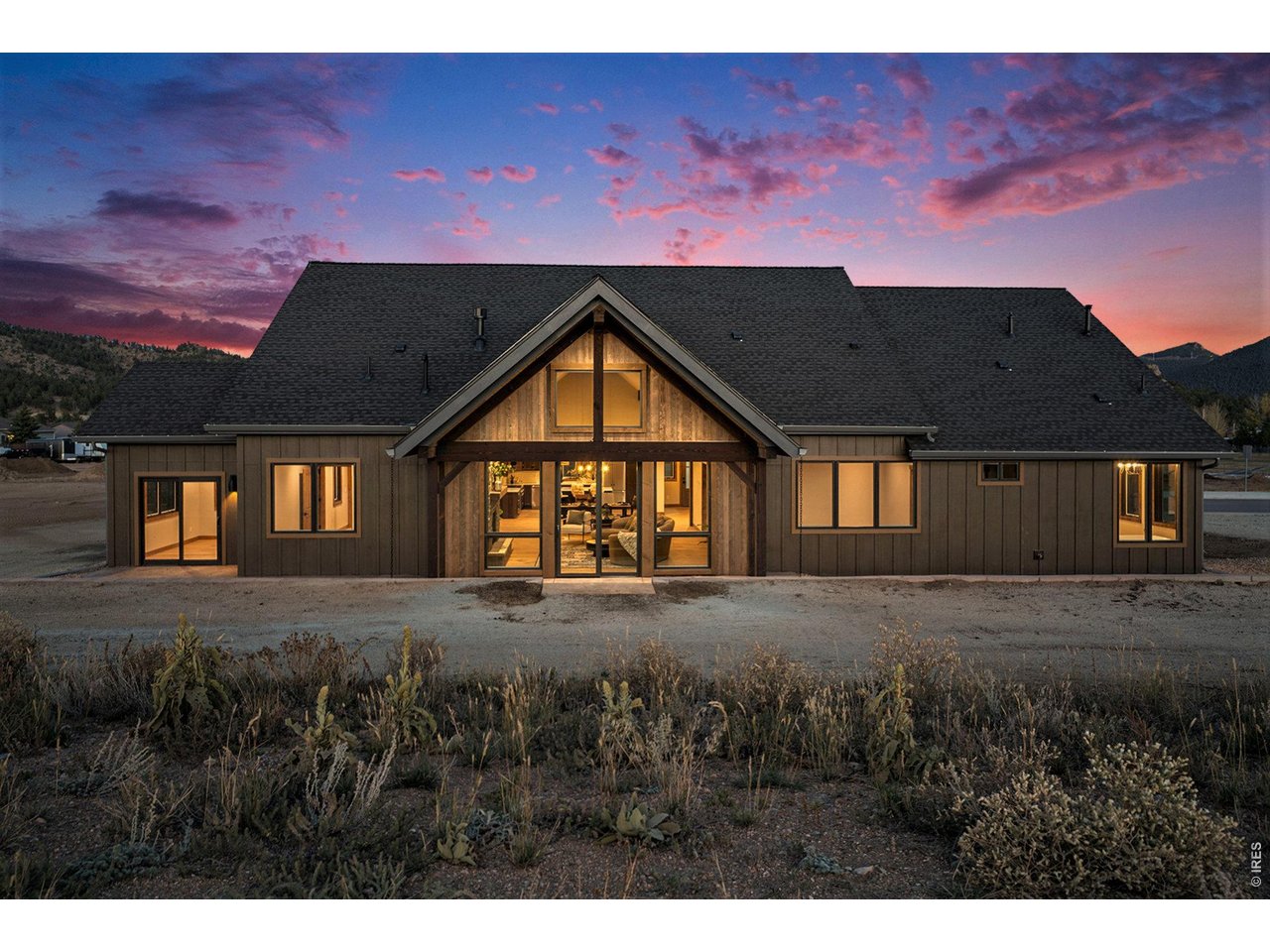 Back of home - Ample windows and two sliding glass doors to patio