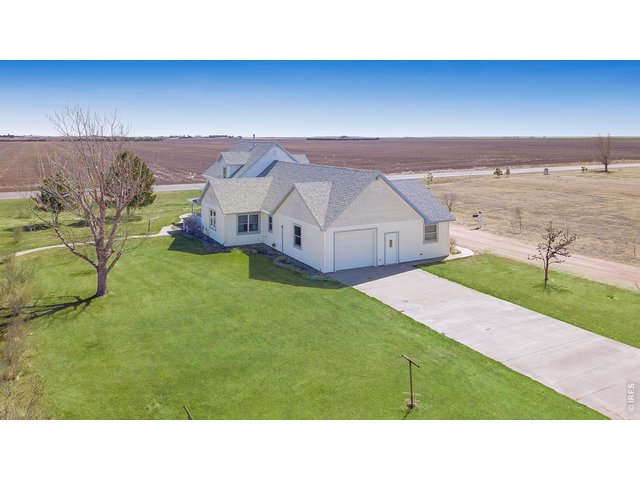 Property Photo 4 Aerial of home looking east
