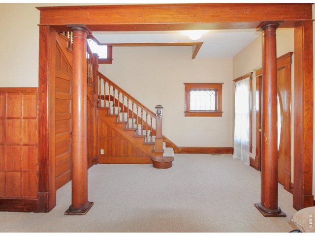Property Photo 8 Entry with original wood work!