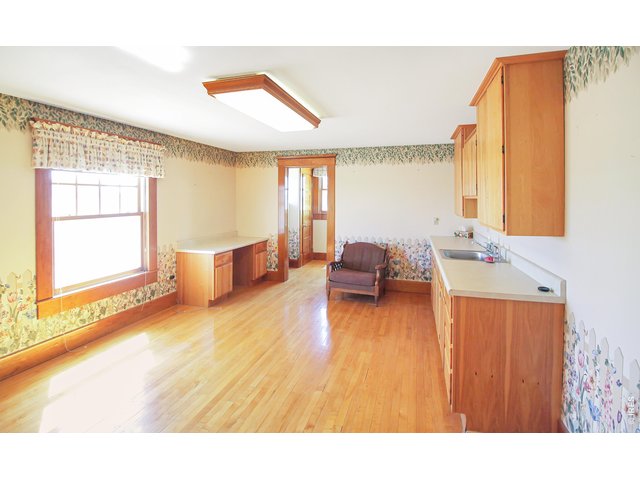 Property Photo 21 Main level 17x13 bonus room with kitchenette & 3/4 bath, great guest room, in-law suite, office, main level primary, or....