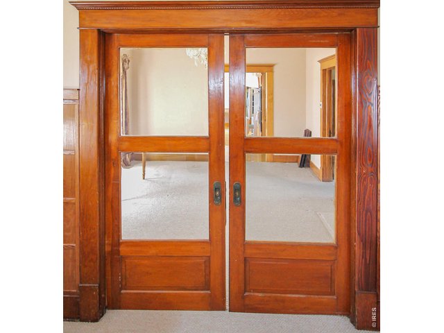Property Photo 9 Original pocket doors between Living and Dining rooms