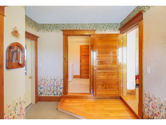 Property Photo 20 Mud room entry off south porch, garage to the left, kitchen to the right, laundry straight ahead.
