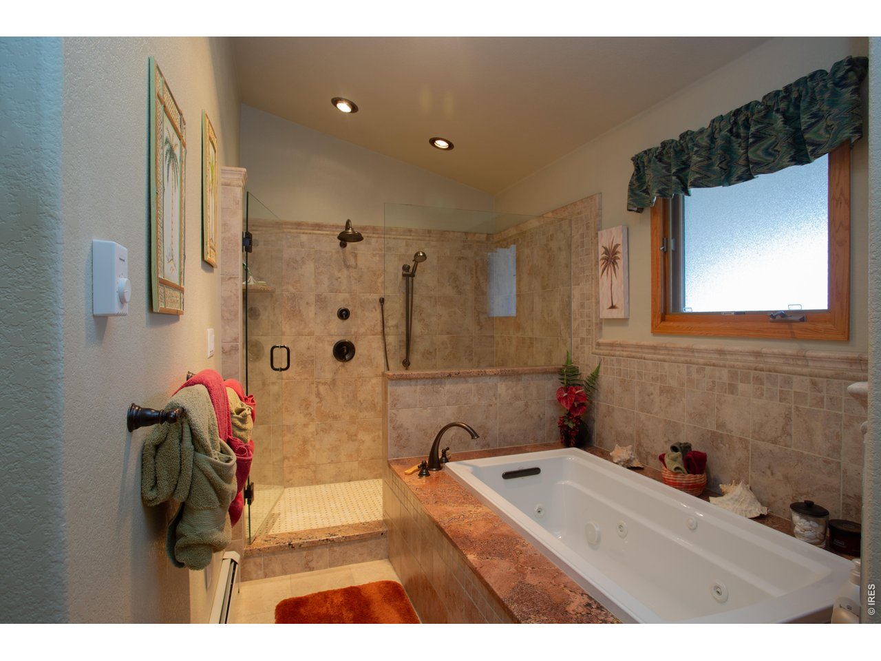 Property Photo 15 Primary suite offers a jetted tub and large walk-in shower