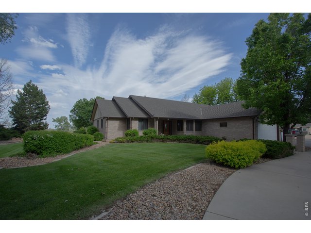 Property Photo 2 Brick ranch amidst great landscaping on one acre