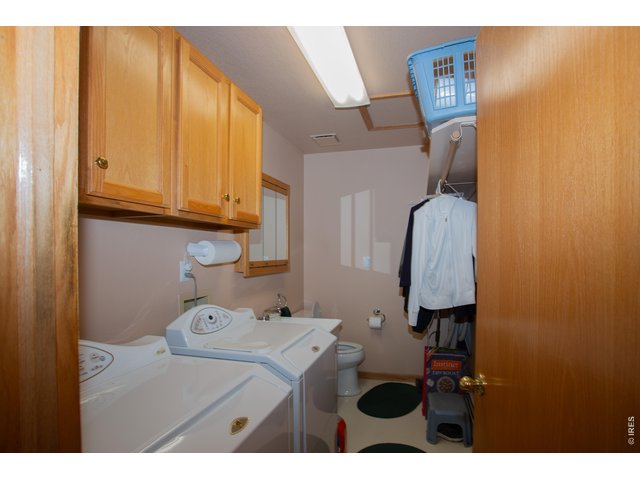 Property Photo 24 The main floor laundry roon is off the garage to double as a mud room and half bath.