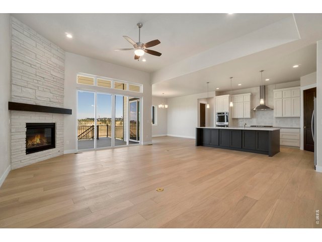 Property Photo 8 Great Room with Gas Fireplace and Trinsic Sliding Glass Door