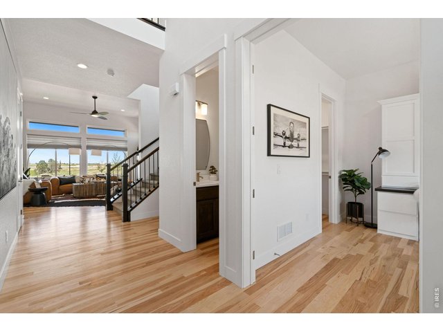Property Photo 6 Beautiful Entry with Site Finished Hickory Wood Flooring