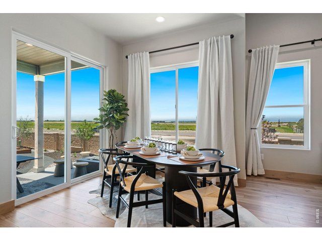 Property Photo 10 Dining Area off Kitchen with Patio Access