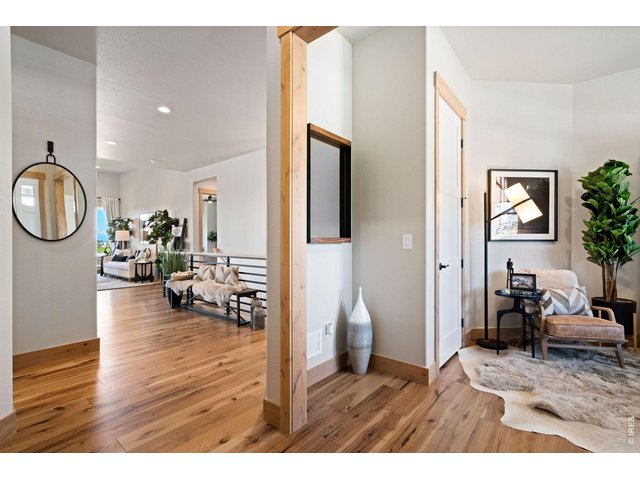 Property Photo 17 Welcoming Entry - Beautiful Engineered Wood Flooring