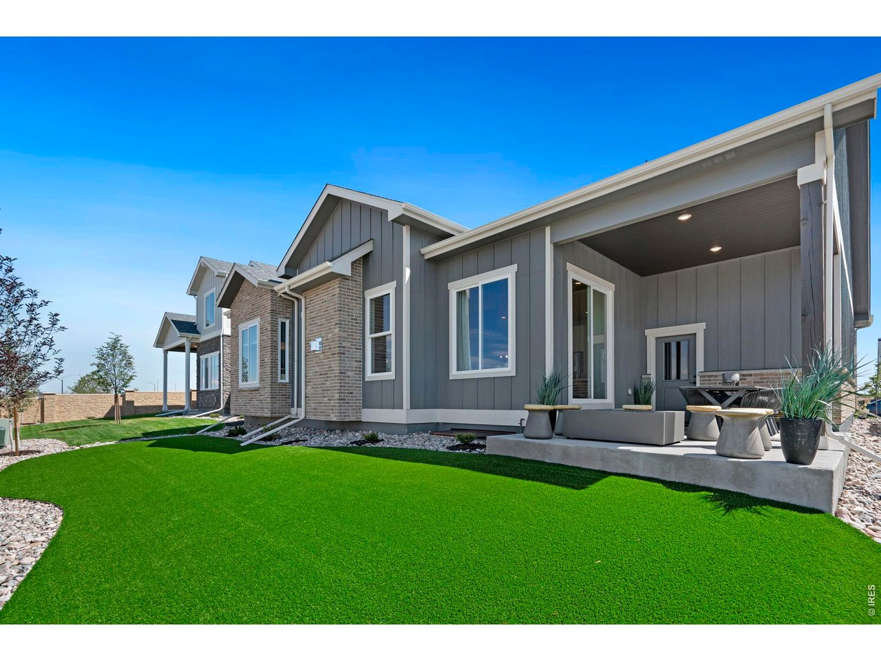 Low Maintenance Living with turf backyard