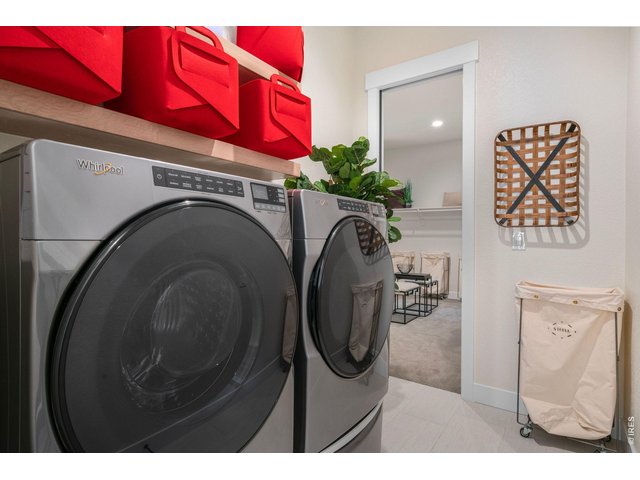 Property Photo 21 Main Floor Laundry/mud room with pass through to primary closet