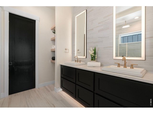 Property Photo 16 Dual Sinks, Lighted Mirrors, Toe kick Lighting!