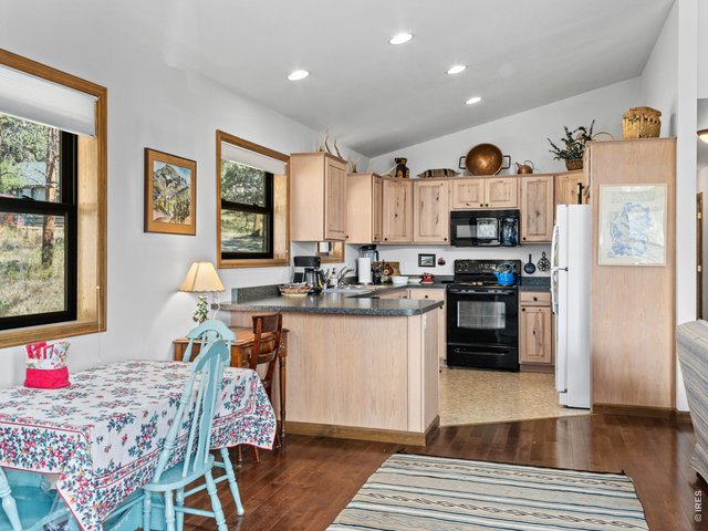 Property Photo 6 Functional kitchen with dining area from the entry