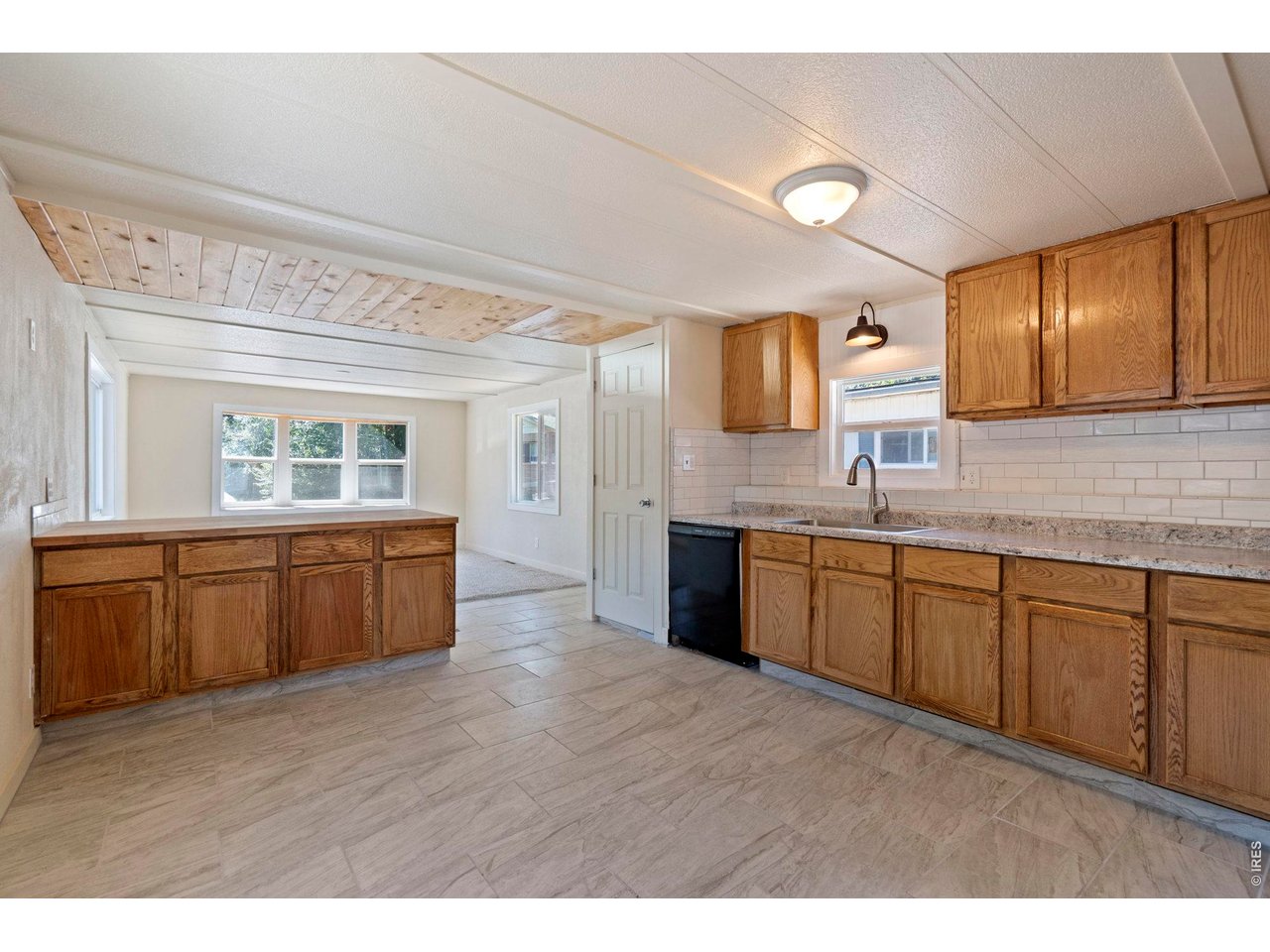 Kitchen is SPACIOUS! Plenty of room for a dining room table. 