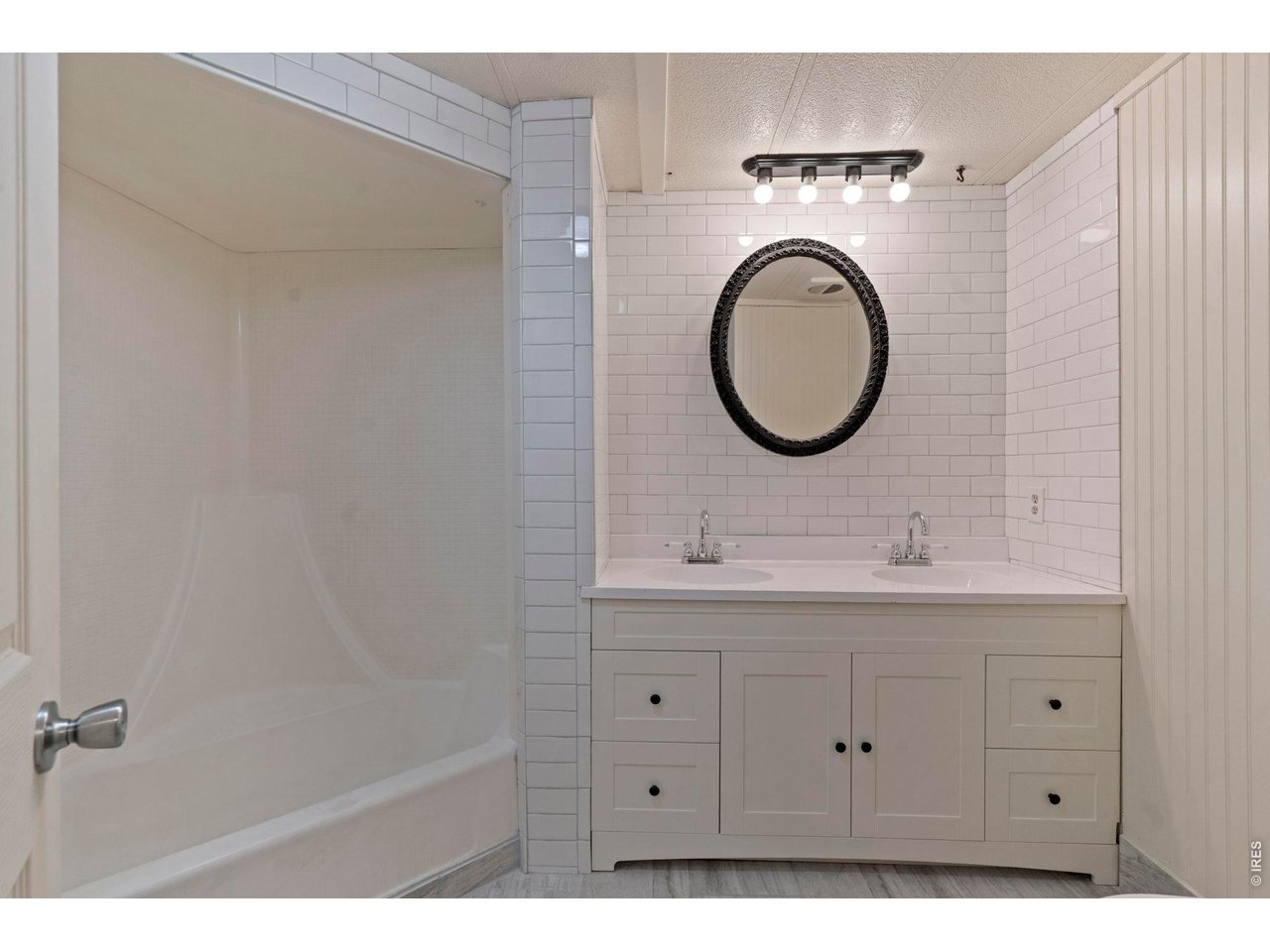 The full bath has been totally remodeled. Love the tile backsplash that goes all the way to ceiling. Not pictured is the full length mirror. 