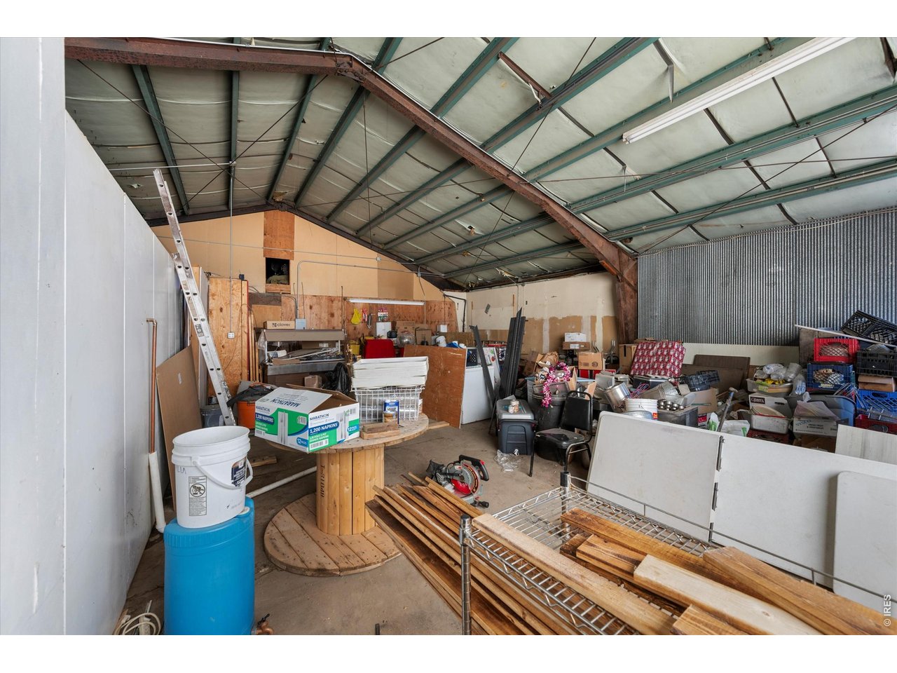 Property Photo 10 Storage with garage door would make a great event space if fixed up