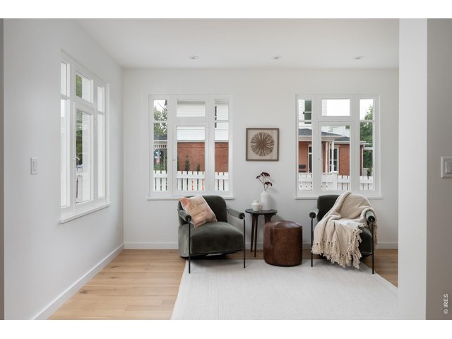 Property Photo 6 Sun-filled sitting room or dining room flex space. 