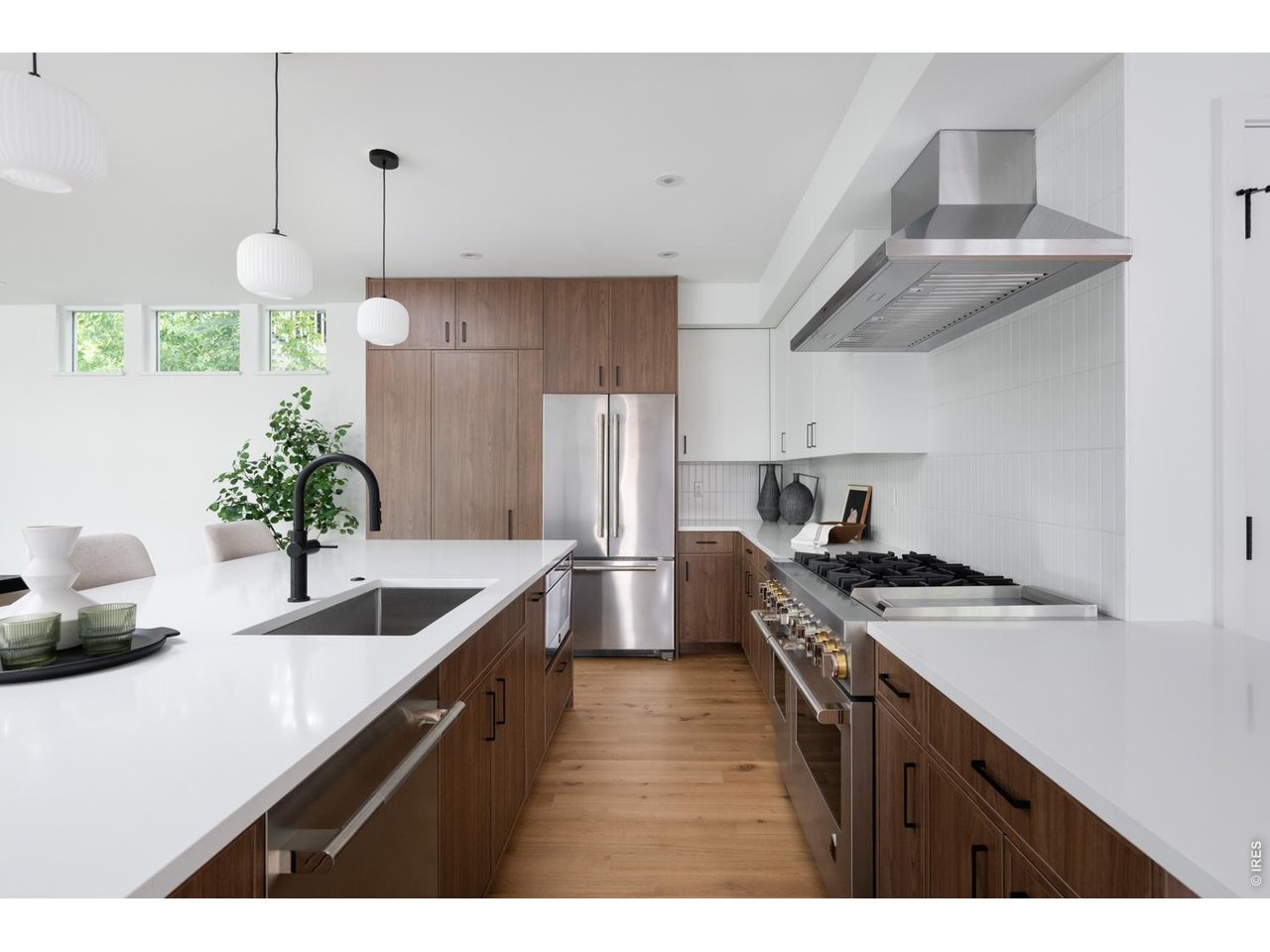 Gourmet chef's kitchen with spacious, hidden walk-in pantry 