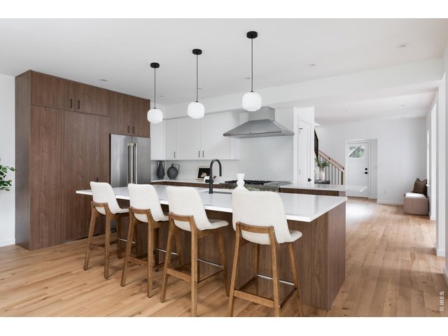 Property Photo 10 Stunning custom cabinetry and ample seating at the oversized kitchen island. 