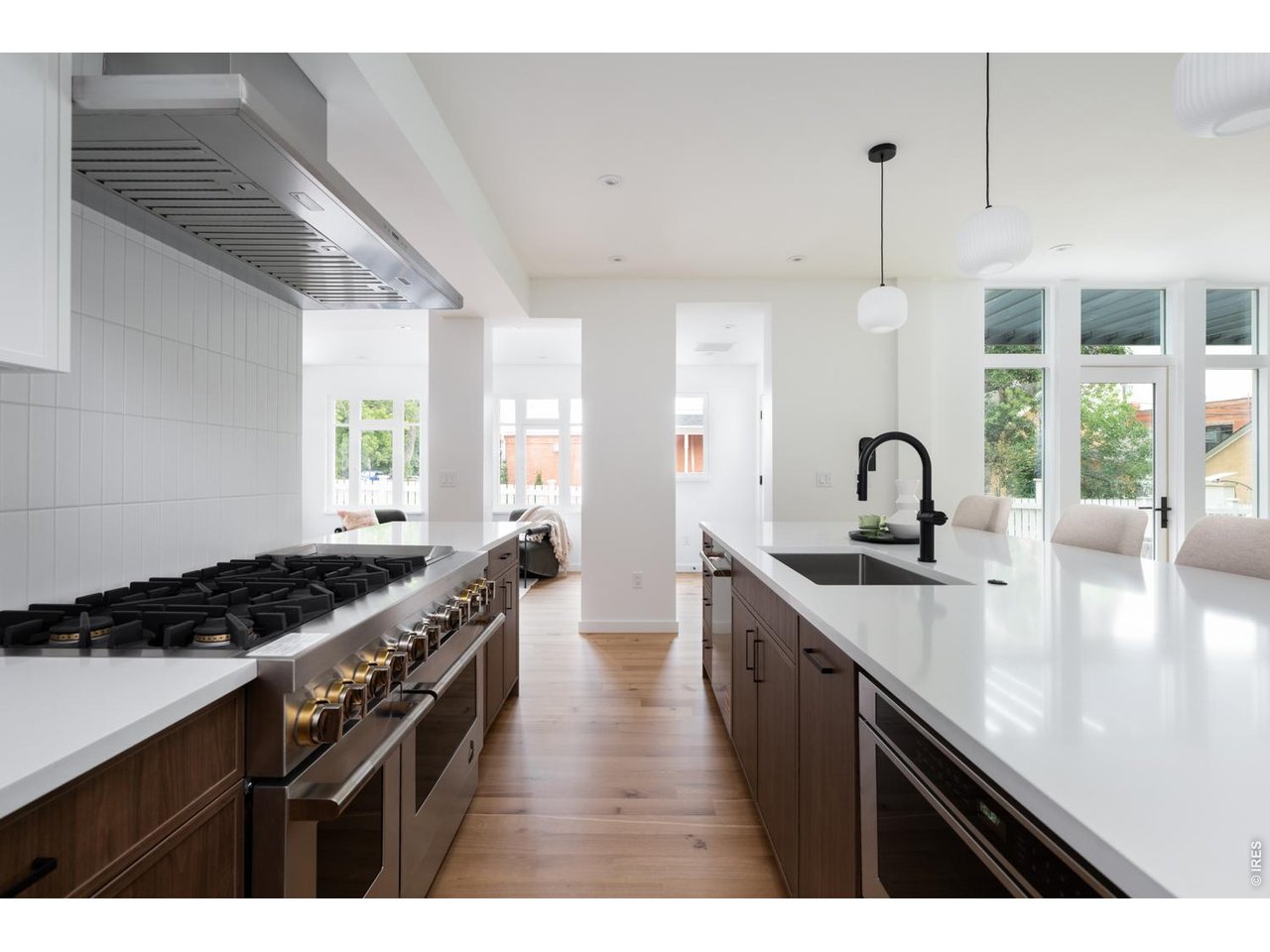 Top-of-the-line appliance suite with designer pendant lighting. 