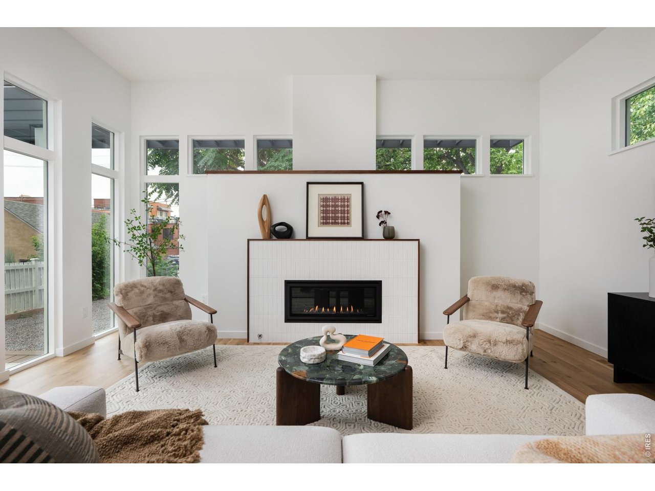 Cozy gas fire place with floor to ceiling windows.