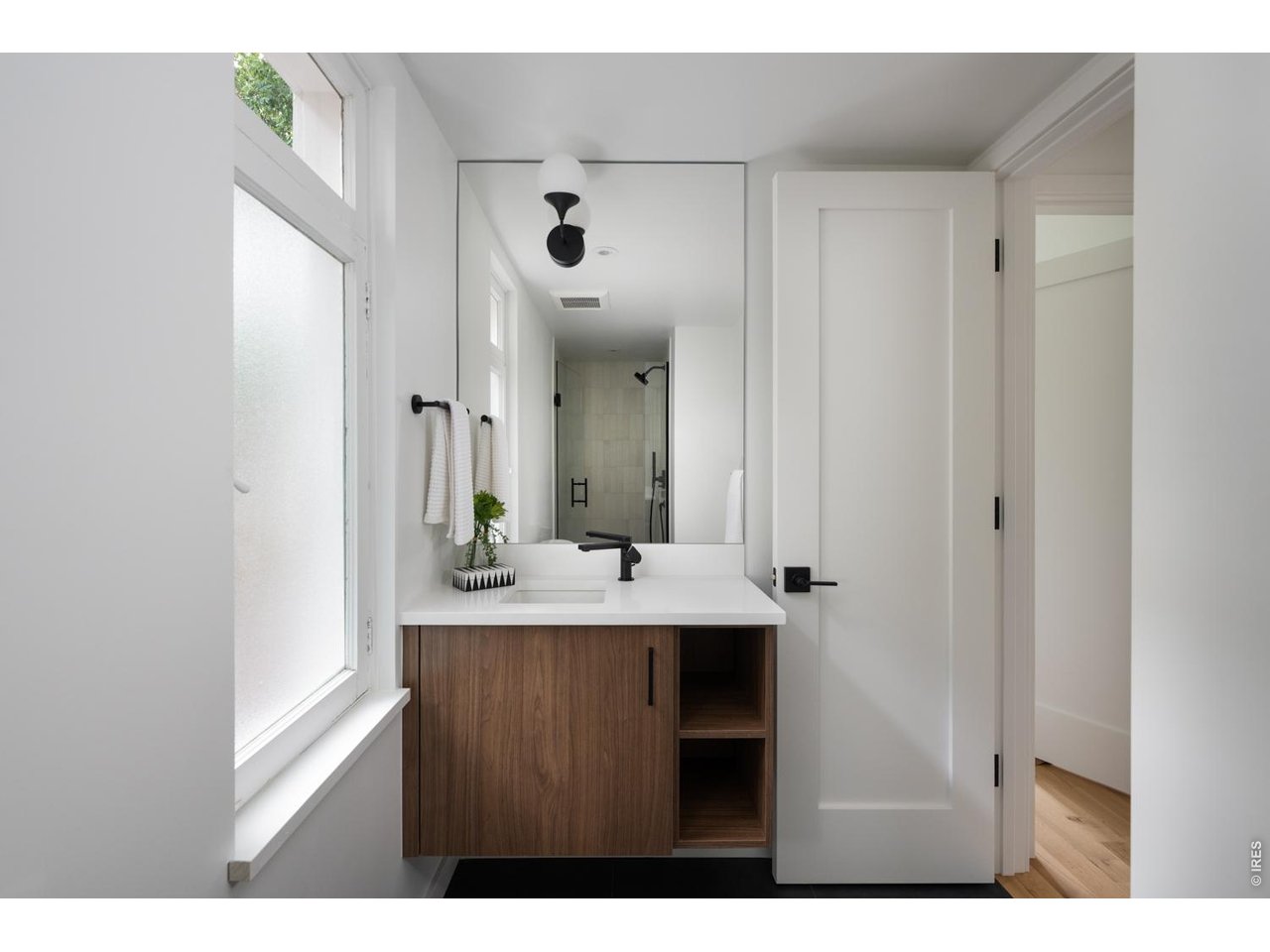 3/4 bath on main level with custom vanity. 
