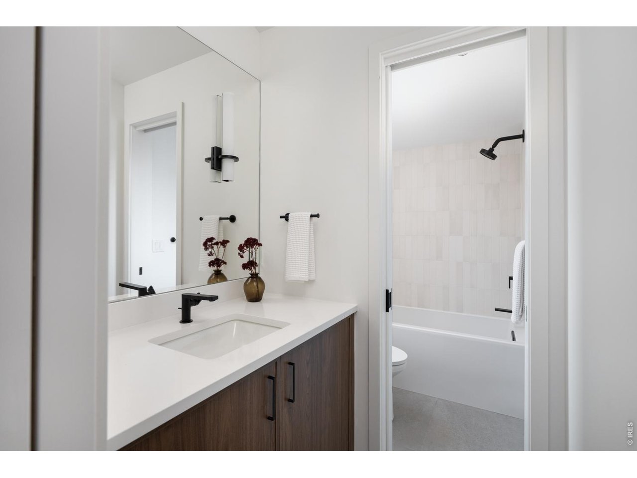 Full ensuite bath with custom vanity. 