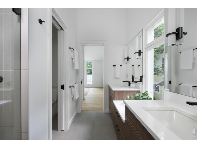 Property Photo 28 Private water closet and glass walk-in shower for primary suite. 