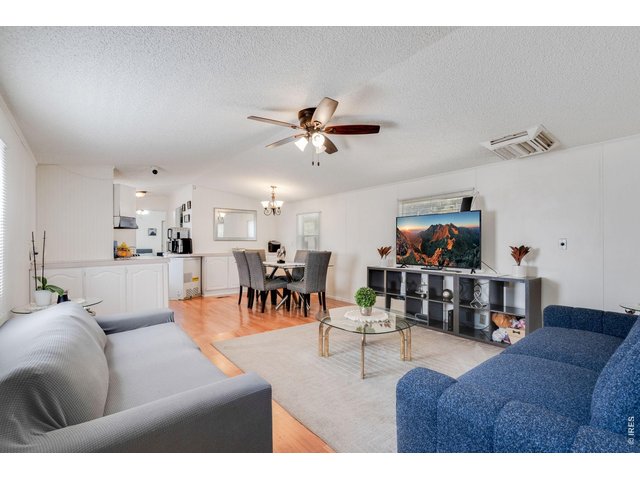 Property Photo 5 Open floor plan with ample lighting.