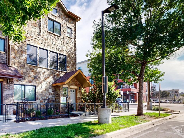Property Photo 1 Perfectly set on a tree lined path with its own private garden space and oversized enclosed garage, this charming retreat offers both a beautiful entry into Fort Collins' Old Town River District, as well as a serene escape.