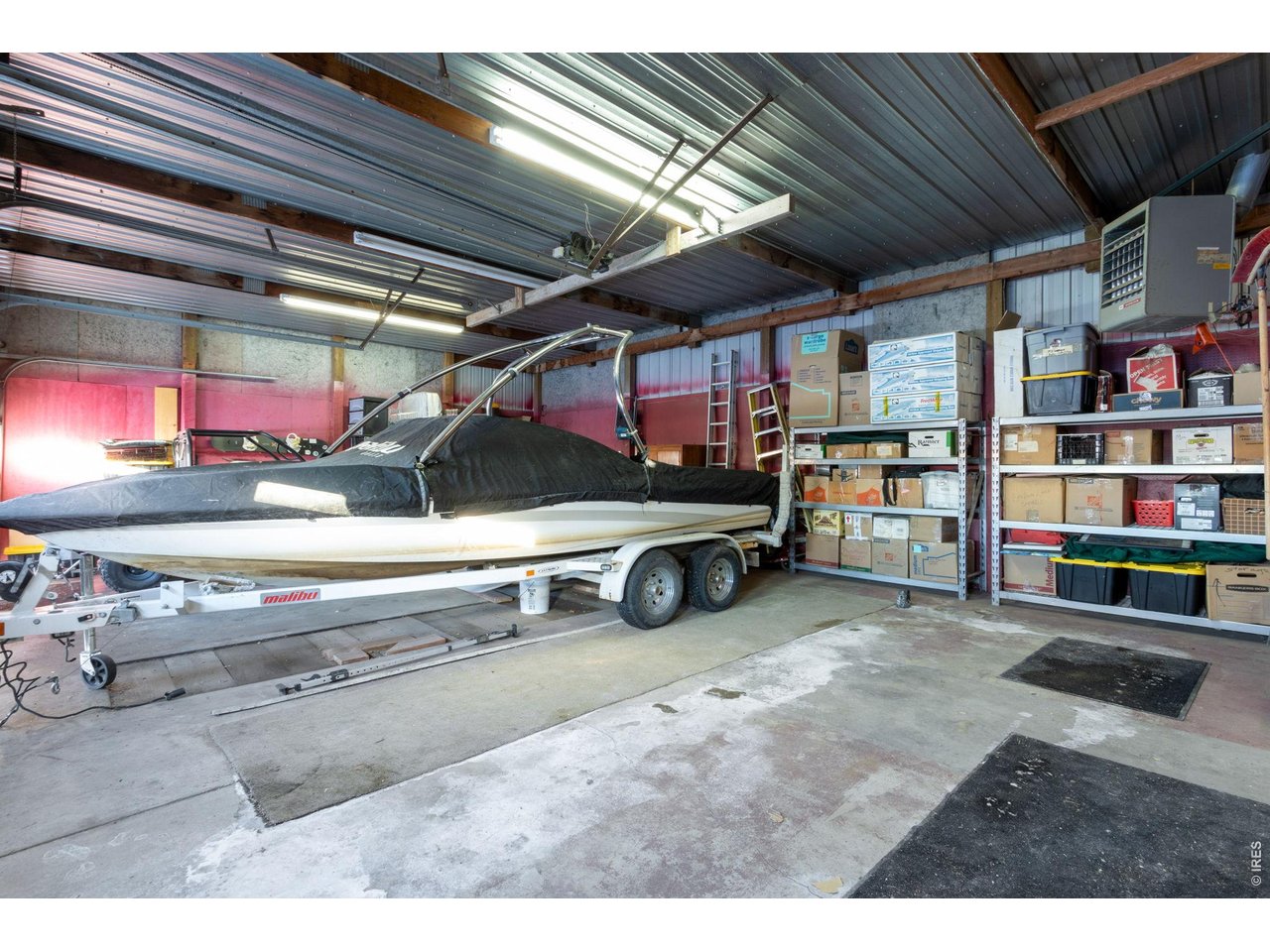 There is also a concrete-floored carport with over 10' of clearance for boats, tractors, or whatever else you need to store. 