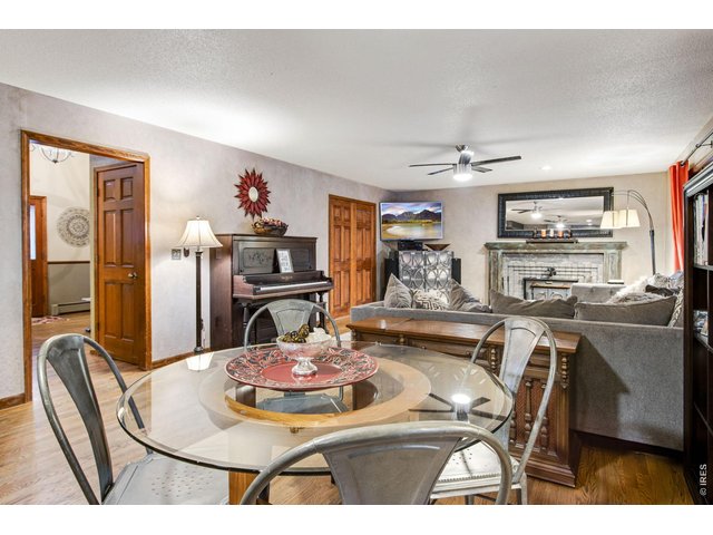 Property Photo 27 Tile floors in front of wood-burning stove for easy cleaning, Brick fireplace mantel surrounding stove 