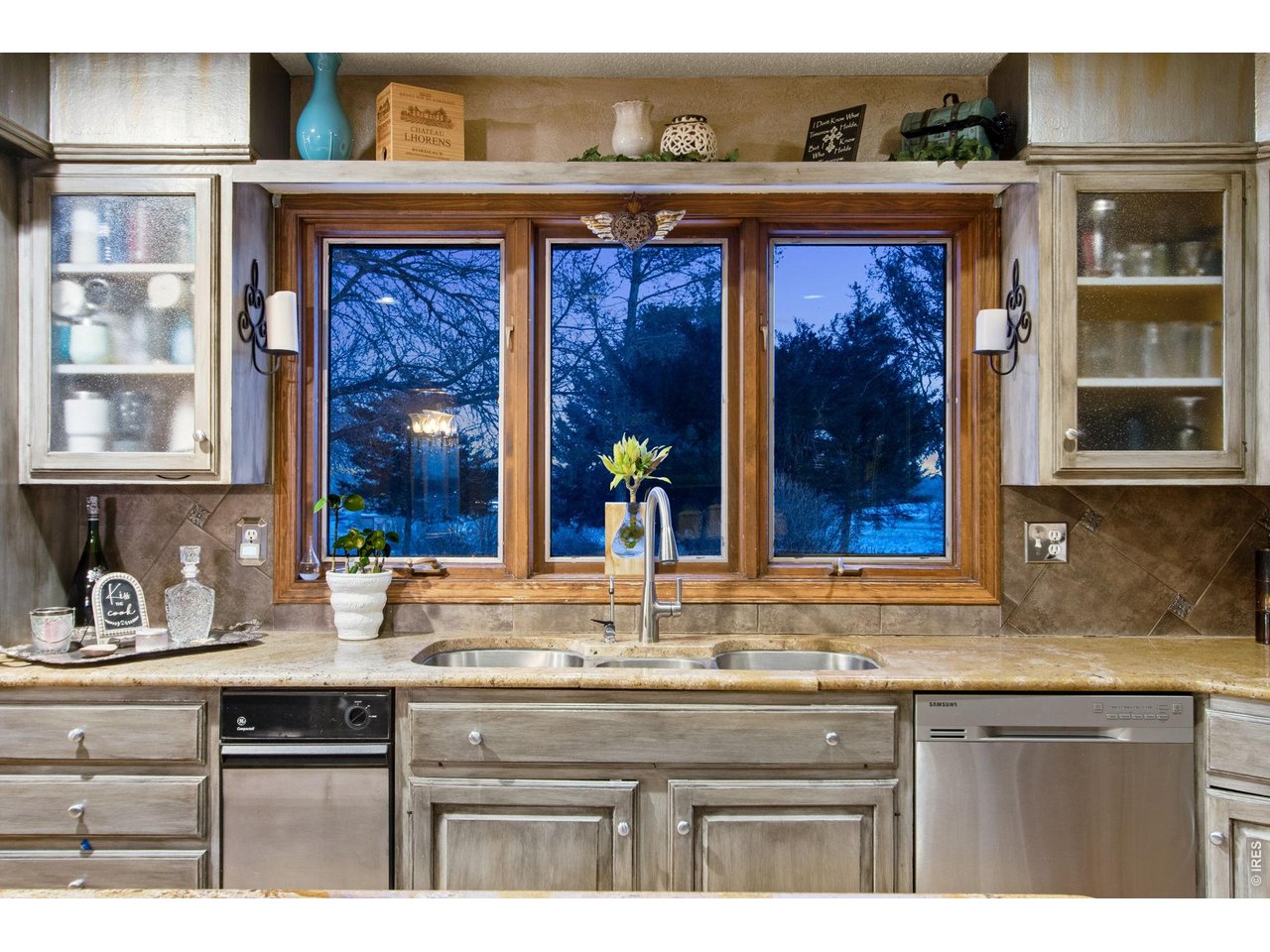 The window above the sink for looking outside while doing dishes 