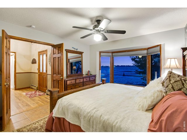 Property Photo 37 Bedroom with window looking out to the lake 