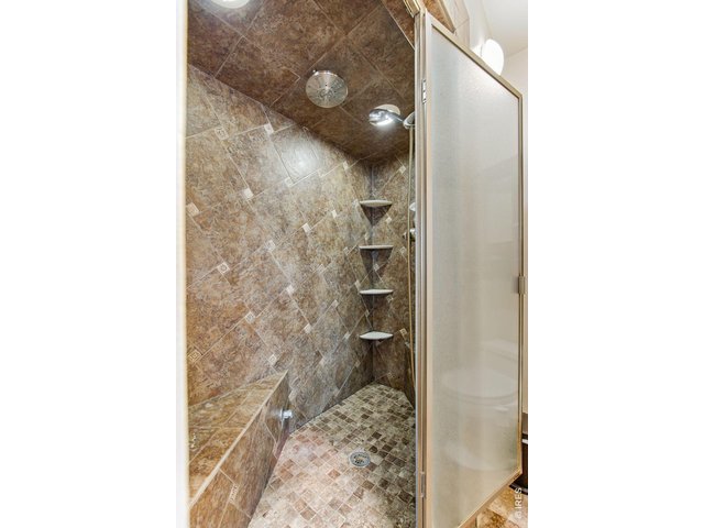 Property Photo 41 Large bathroom with floor-to-ceiling tile shower 
