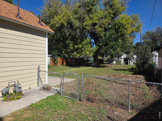 Property Photo 5 Fenced Back Yard